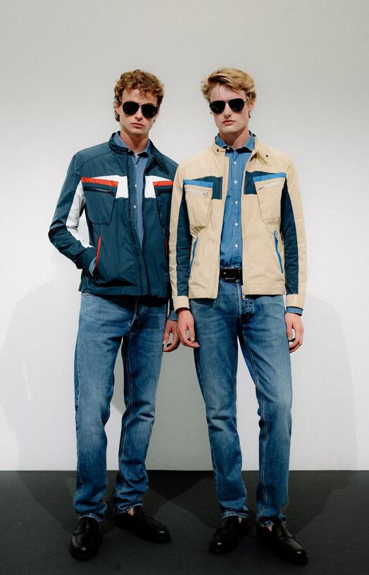 On the starting line, a collection focused on the noble part of the sport, revved up by the roma