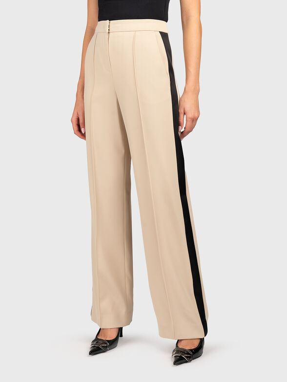 Beige trousers with crease - 1