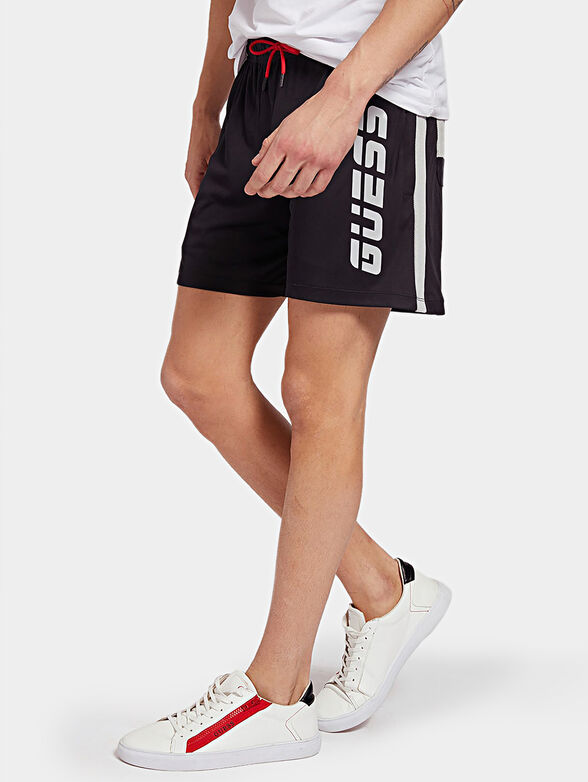 Sports shorts with logo inscriptions - 1