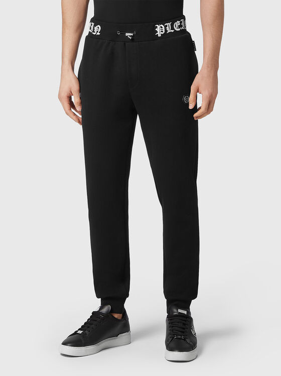 Sports pants with embroidered logo - 1