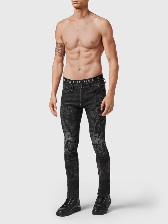 Jeans with washed effect and print - 4