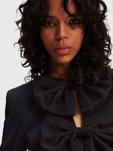 Black dress with accent bows - 4