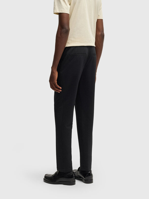 Textured trousers in beige - 2