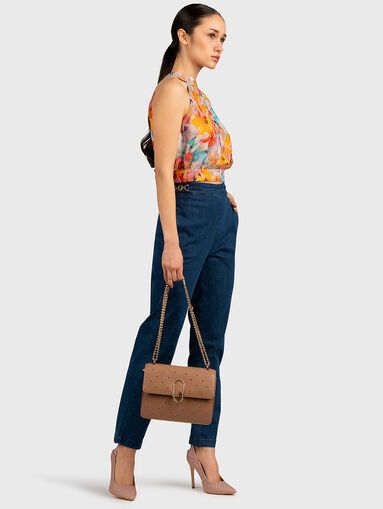 Jeans with metal logo accent - 3