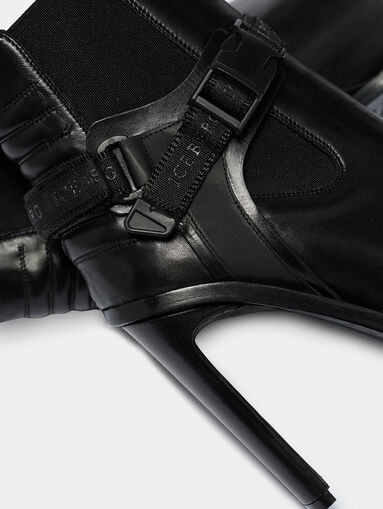 Black leather ankle boots with accent strap - 4