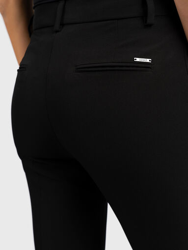 Black pants with appliqued rhinestones - 4
