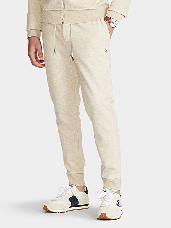 Sports pants in ecru color - 1