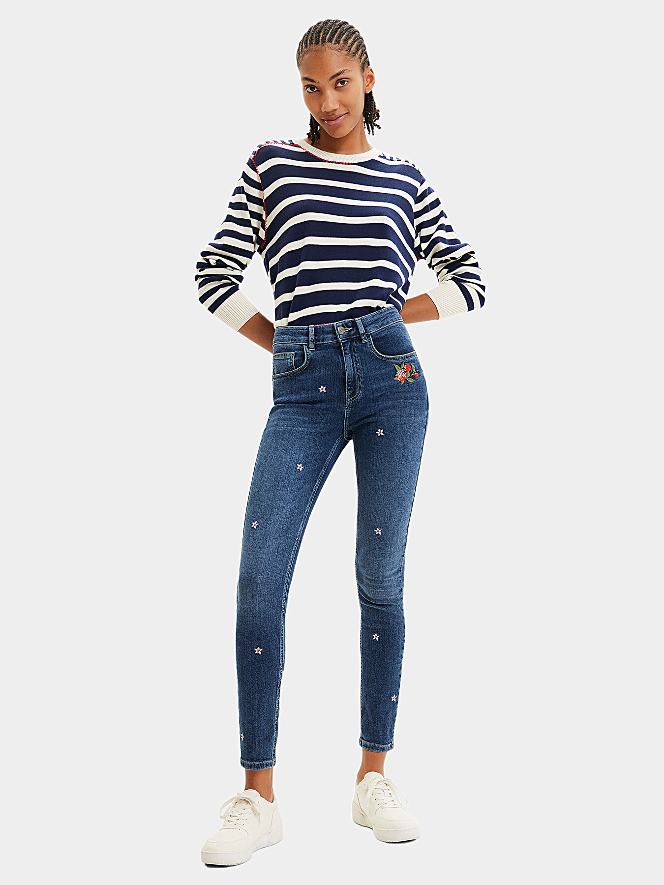 Blue jeans with floral motifs brand DESIGUAL — Globalbrandsstore.com/en