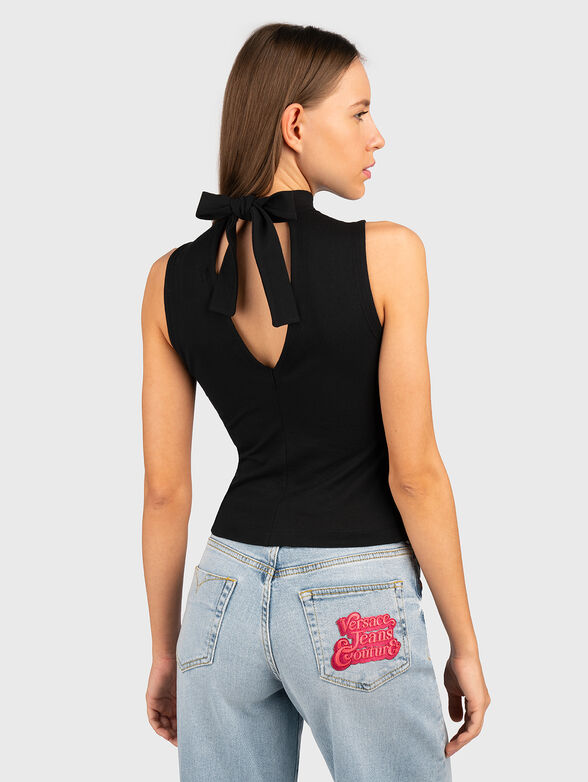 Black top with cut out details and accent back - 2