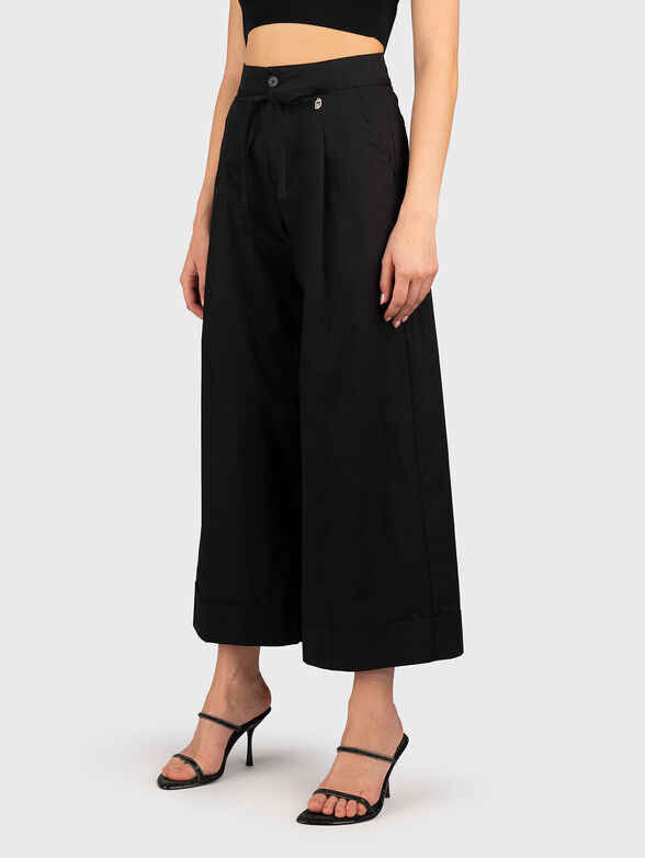 Cotton trousers with wide legs in black - 1