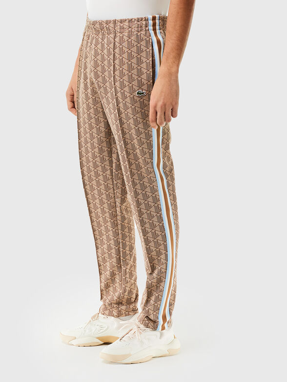 Brown sports trouser with monogram print - 1