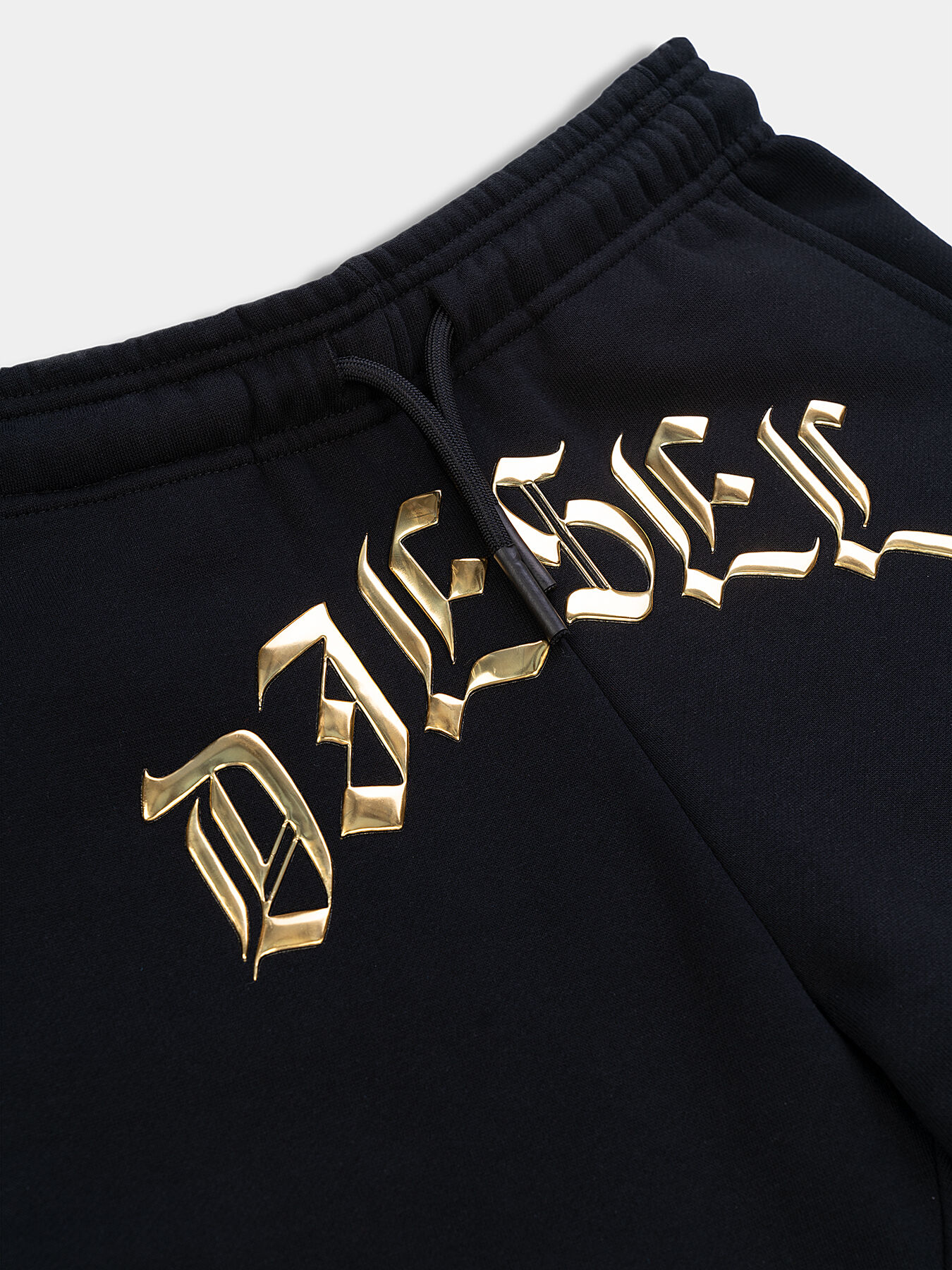 Black sports pants with gold logo brand DIESEL KIDS