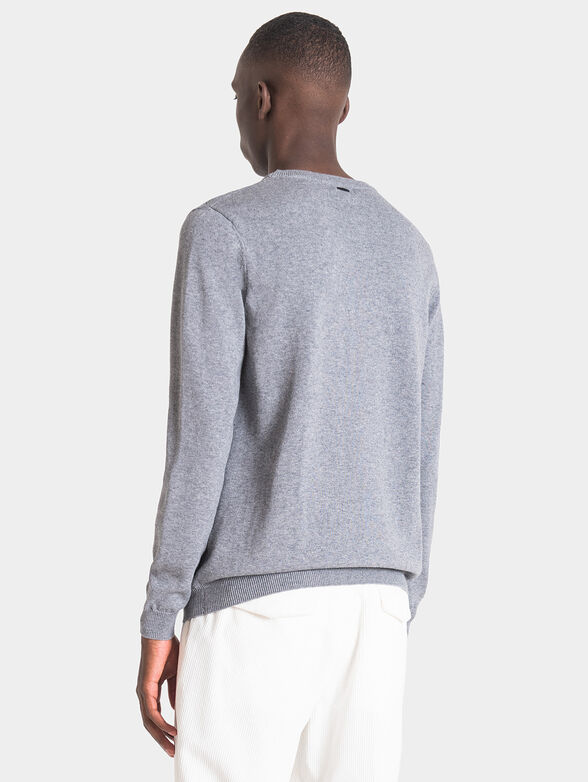 Blue sweater with art details - 3