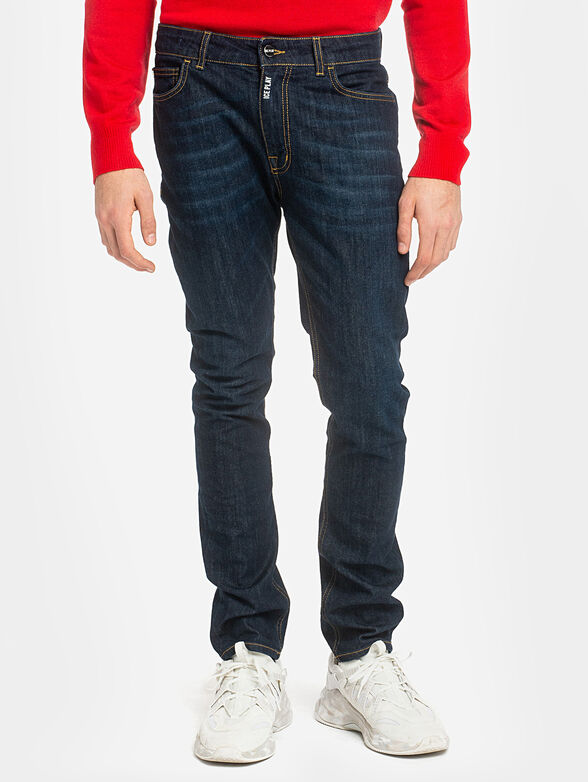 Dark blue jeans with accent stitches - 1