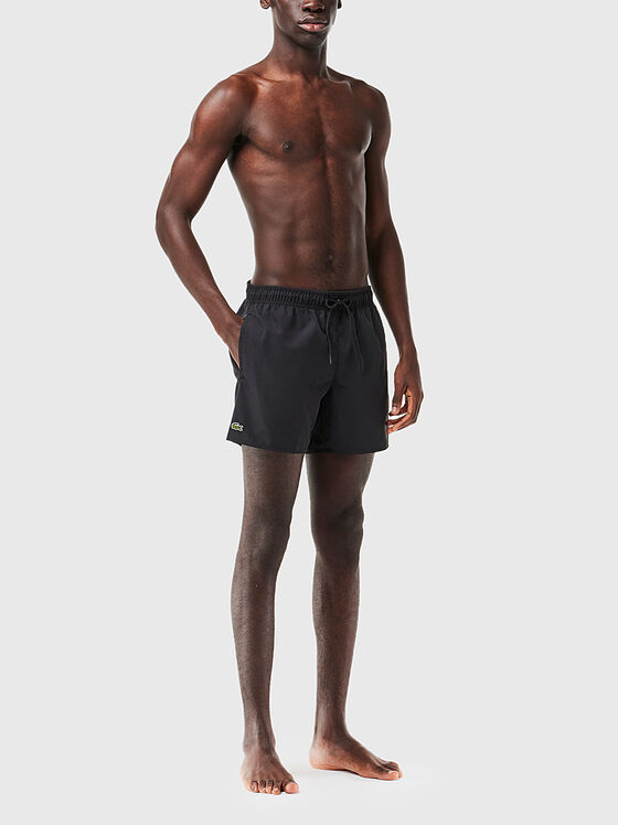 Yellow shorts with logo detail - 1