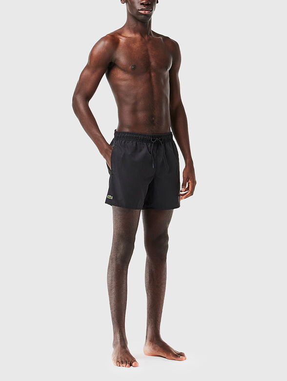 Yellow shorts with logo detail - 1