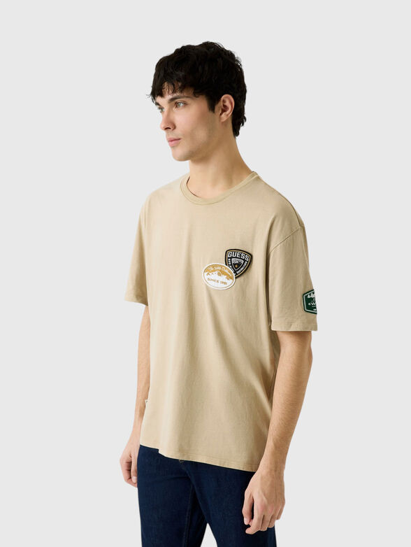 Beige T-shirt with appliqu&eacute;s - 1