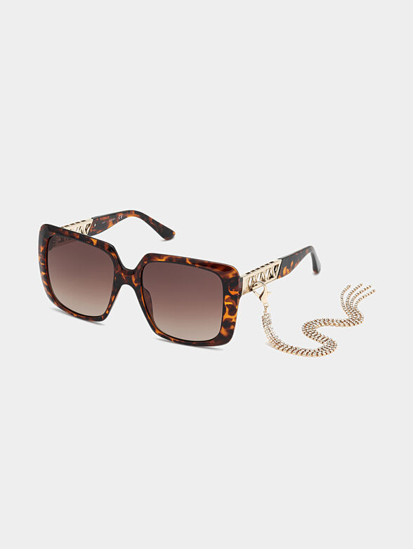 Sun glasses with brown frames and metal detail - 1