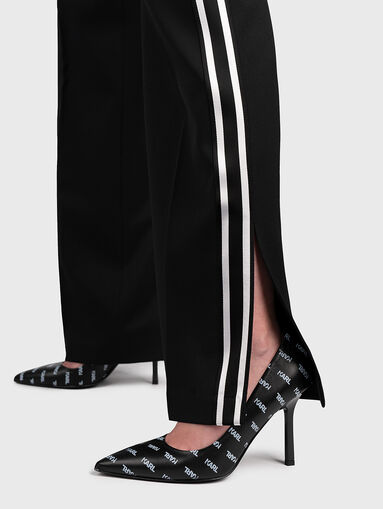 Trousers with flared legs with slits - 3