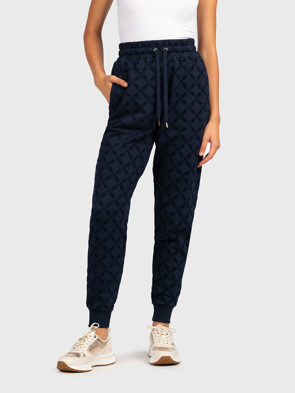 Sports trousers with monogram print - 1