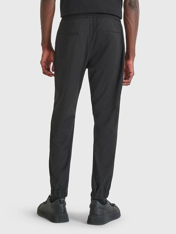 Trousers with pockets and mini logo - 2