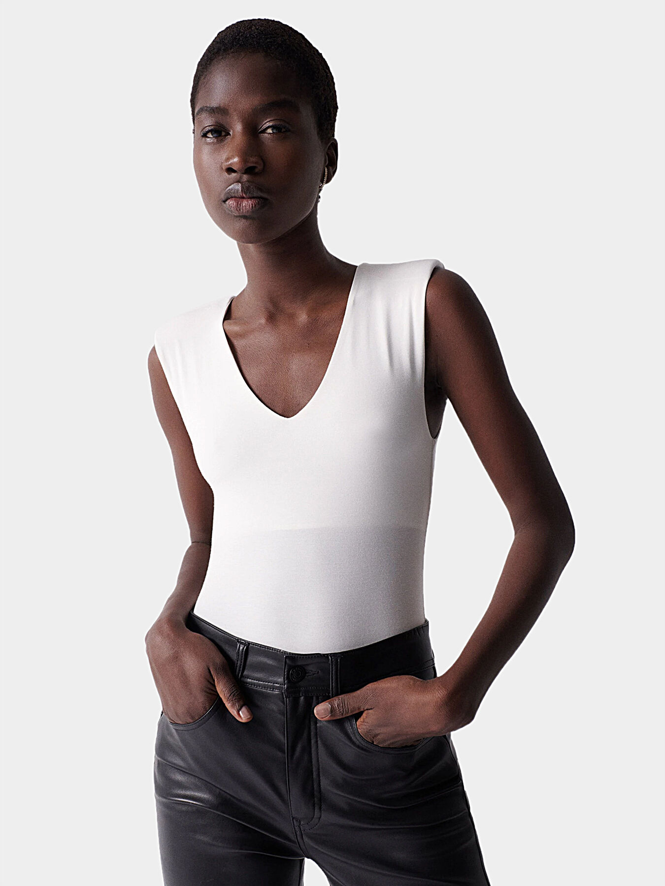 White sleeveless top with shoulder pads clearance