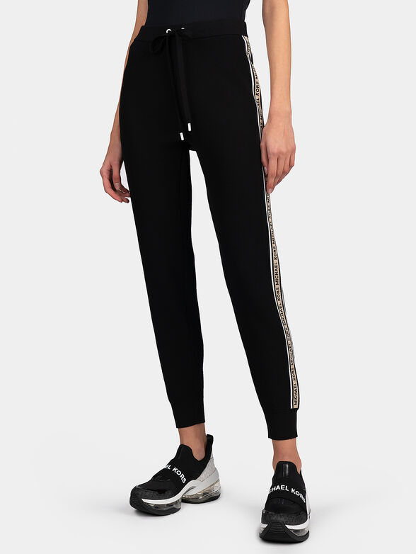 Track pants with branded stripes - 1