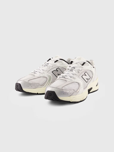 530 white sports shoes with logo accent - 5