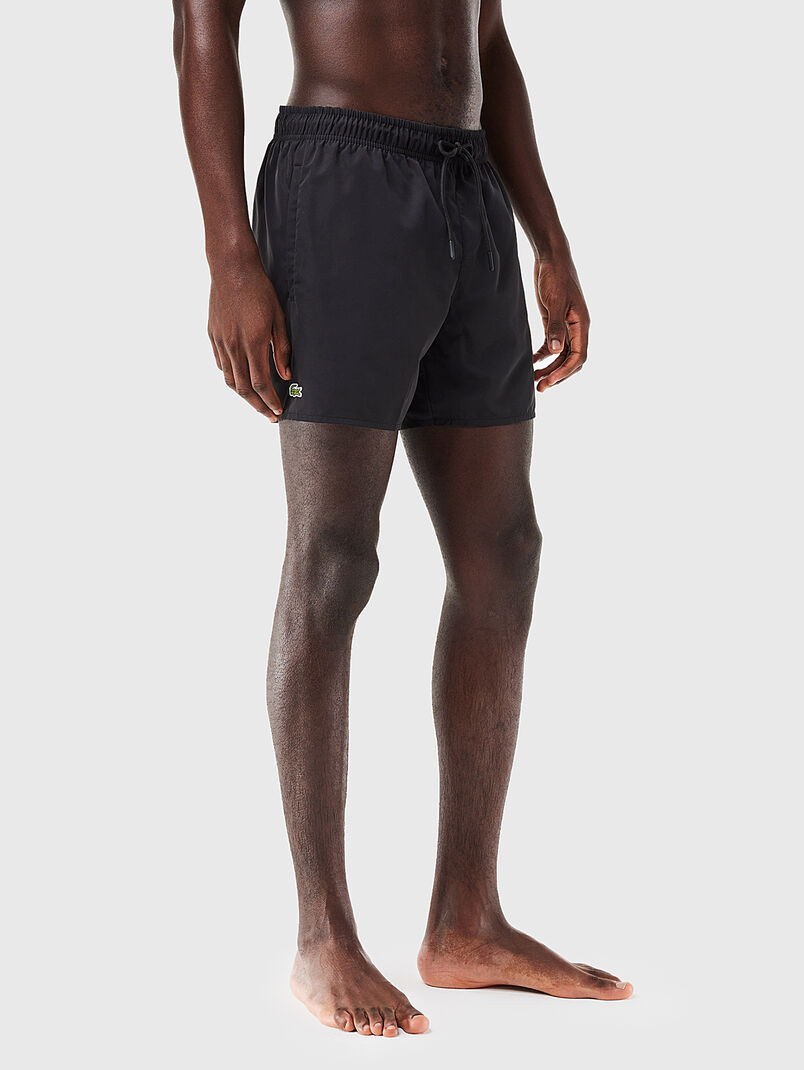 Yellow shorts with logo detail - 3