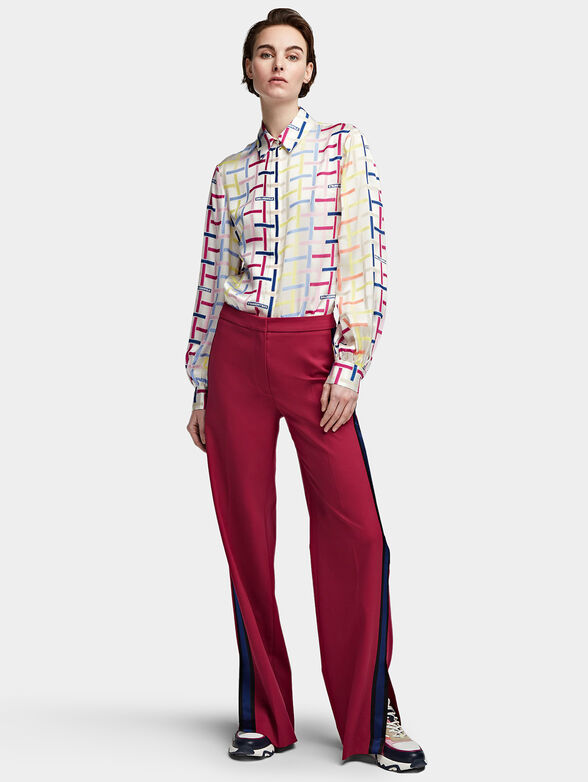 Trousers with flared legs with slits - 1