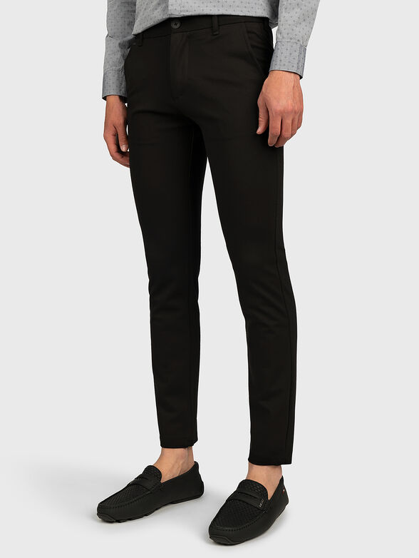 MYRON Slim trousers in black color - 1