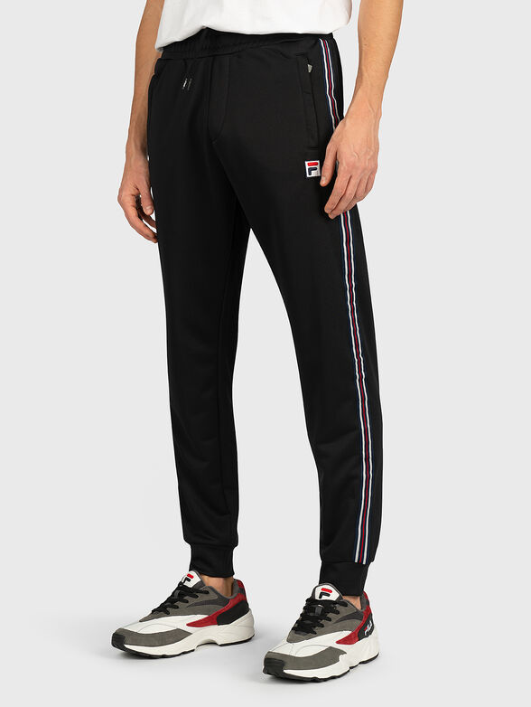 SALIH Track pants in black - 1