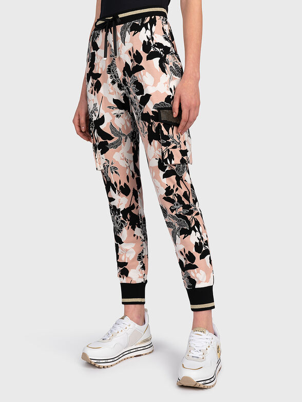 Cargo trousers with floral print - 1