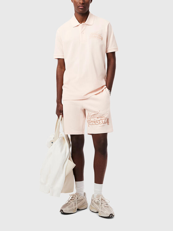 Cotton shorts with logo print in ecru - 1