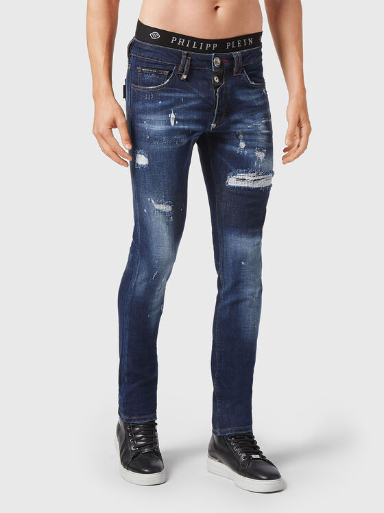 Jeans with washed effect and rips - 1