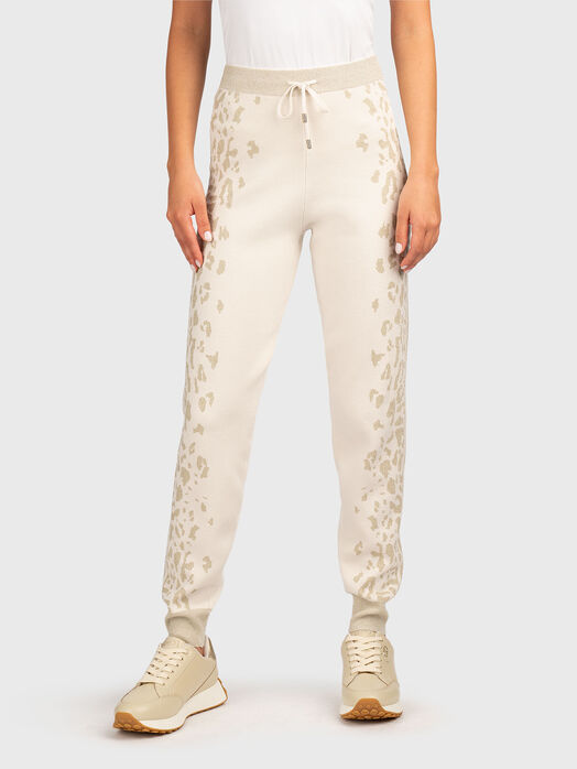 Sports pants with elastic cuffs and animal print