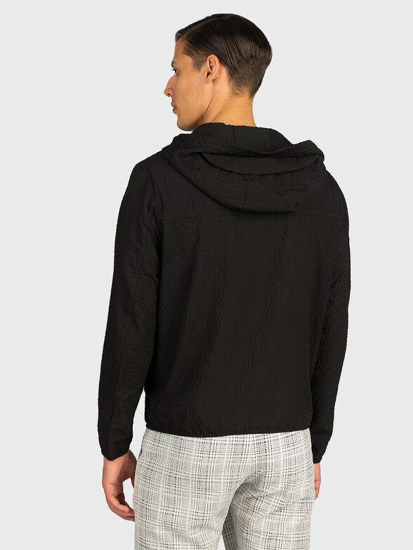 Jacket with an asymmetrical fastening - 4