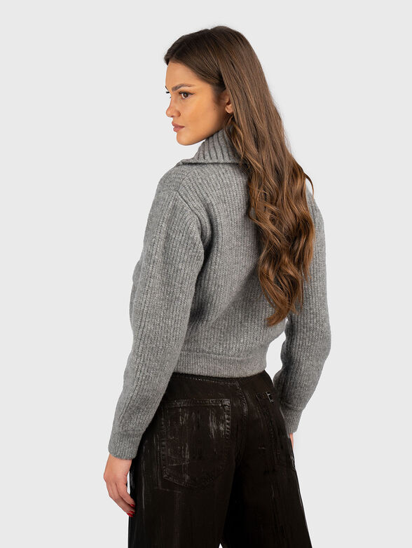 Cardigan with brooch  - 3