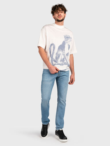 Blue jeans with metal logo accent - 5