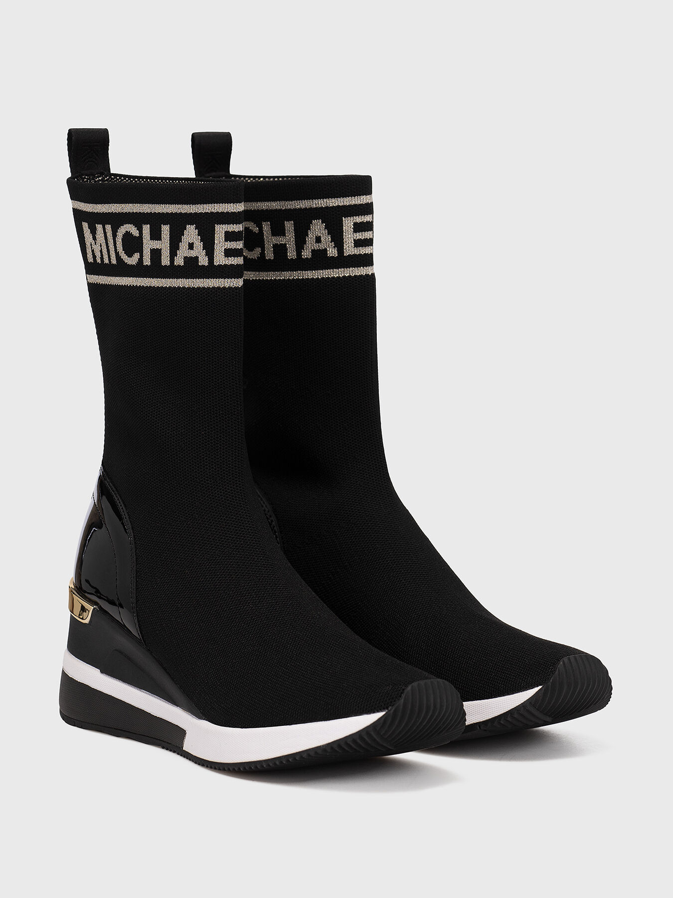 SKYLER slip on boots with logo detail brand MICHAEL KORS Globalbrandsstore en