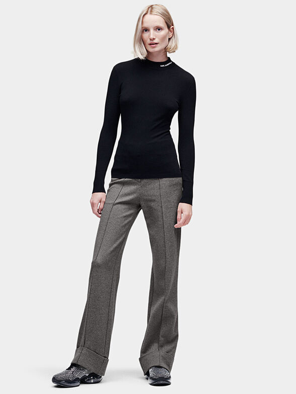 Mock neck sweater in black - 1