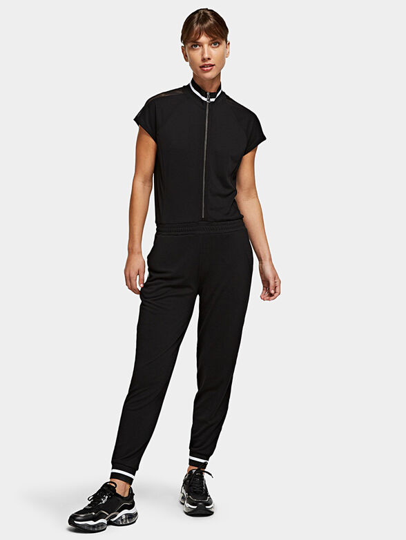 Black jumpsuit with branded tapes - 1