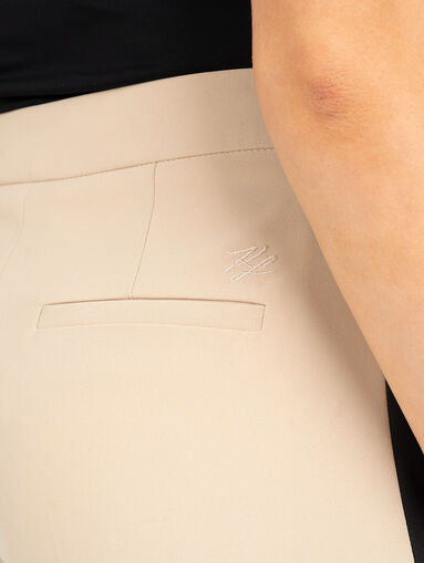 Beige trousers with crease - 4