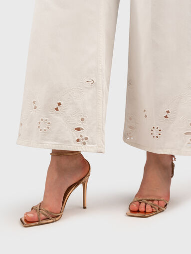 Flared trousers with embroidery - 4