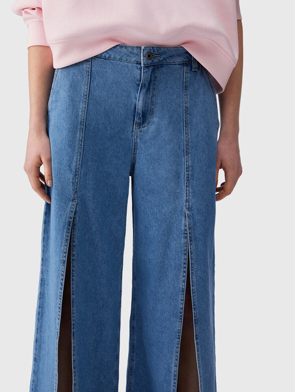 Flared jeans with slits - 3