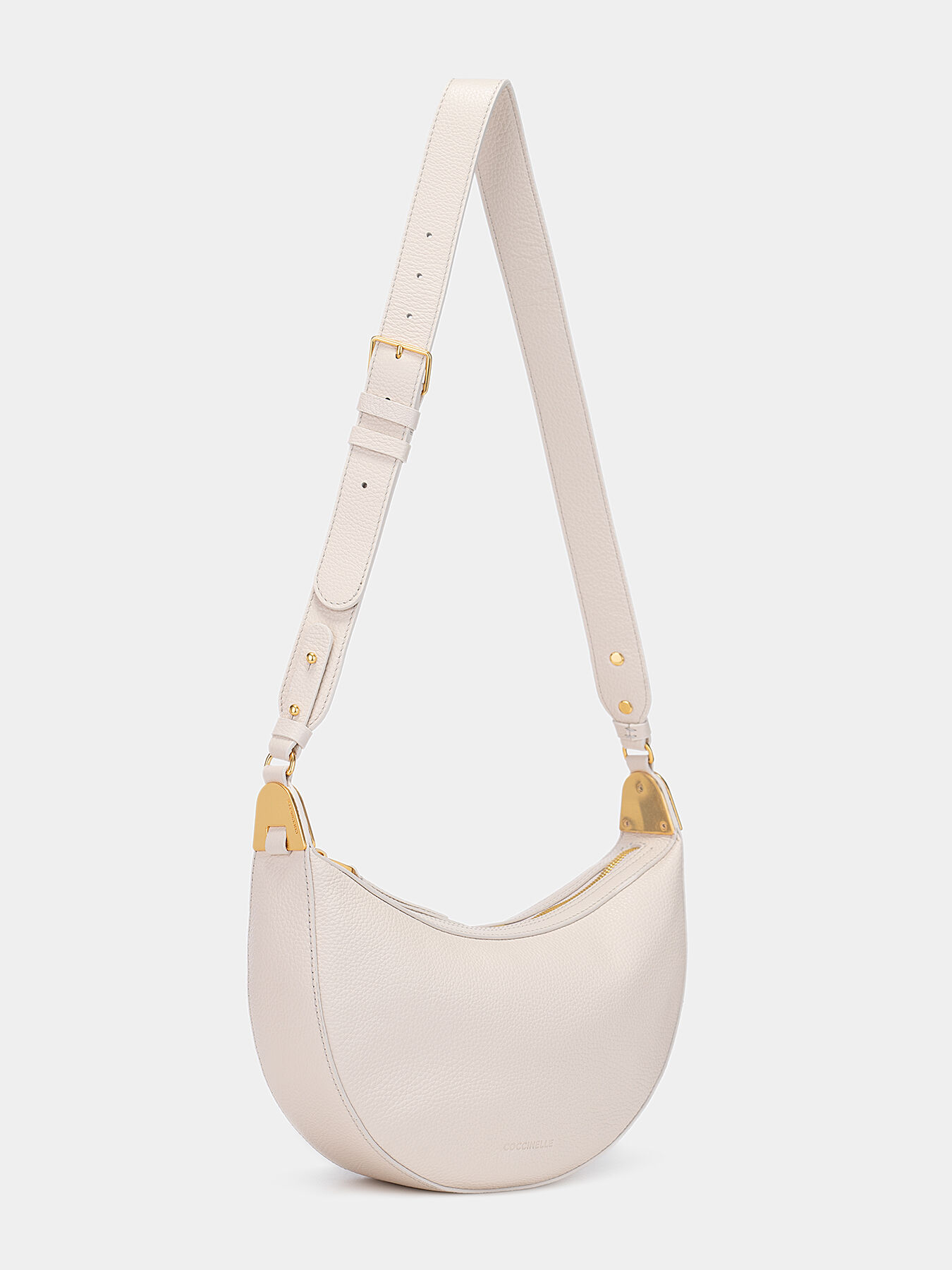 Beige crossbody bag with gold-colored details brand