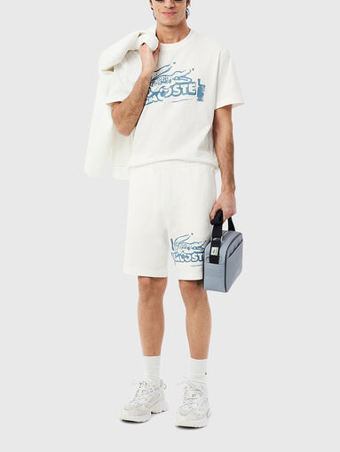 Cotton shorts with logo print in ecru - 5