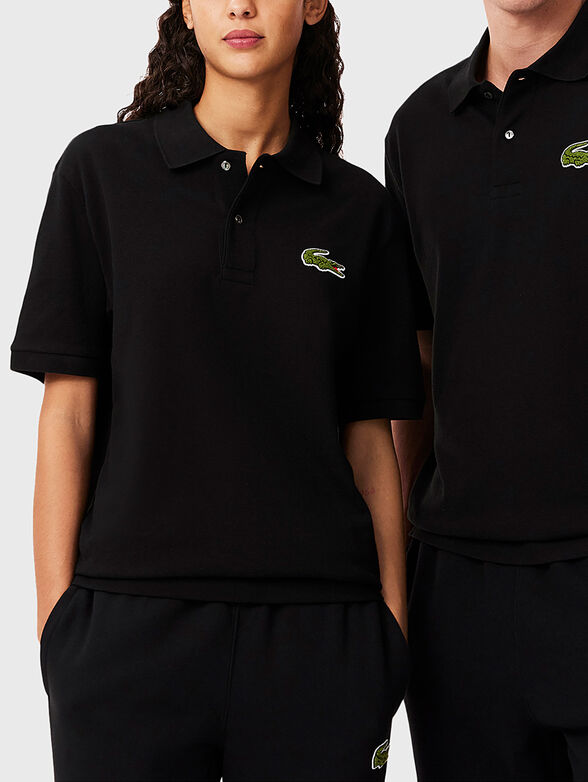 Unisex polo shirt in black - 1