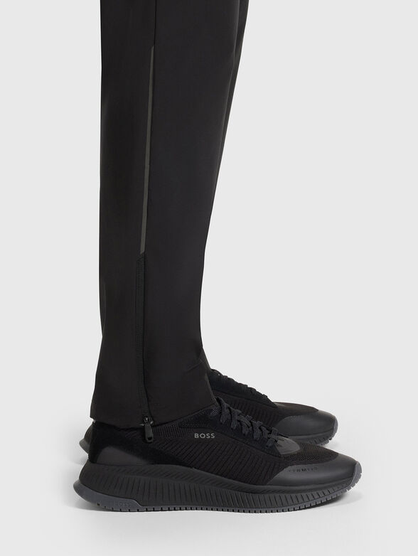 Sport trousers with an accent zip and logo - 4