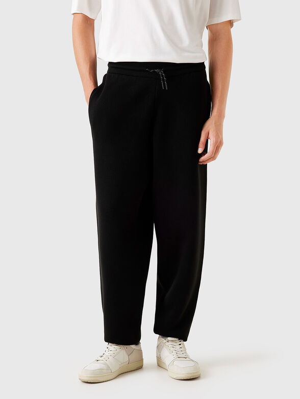 Sports pants with embossed logo - 1